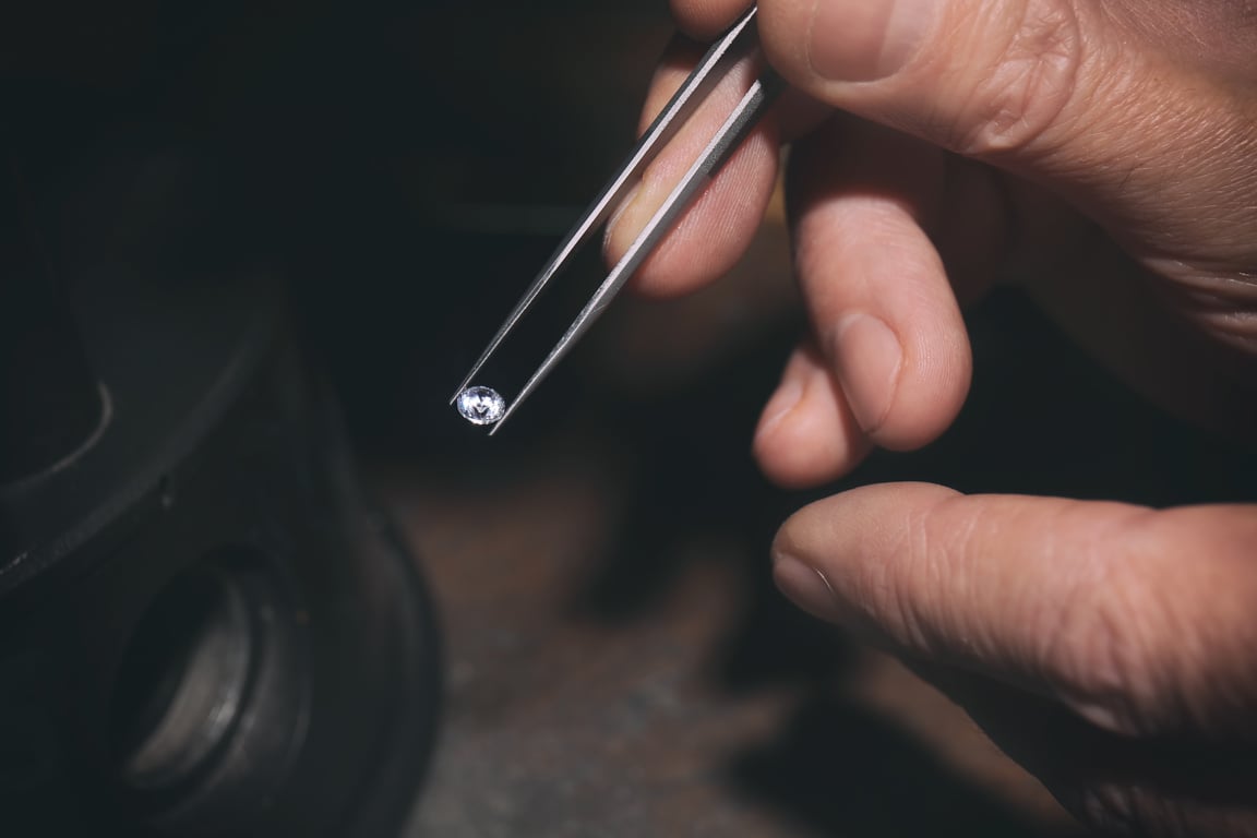 Jeweler Examining Gem 